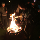 Hsieh, front, and friends gather around the bonfire at airstream park a few weeks ago in downtown Las Vegas, where the Zappos CEO currently lives and is attempting to create an “urban Burning Man.”